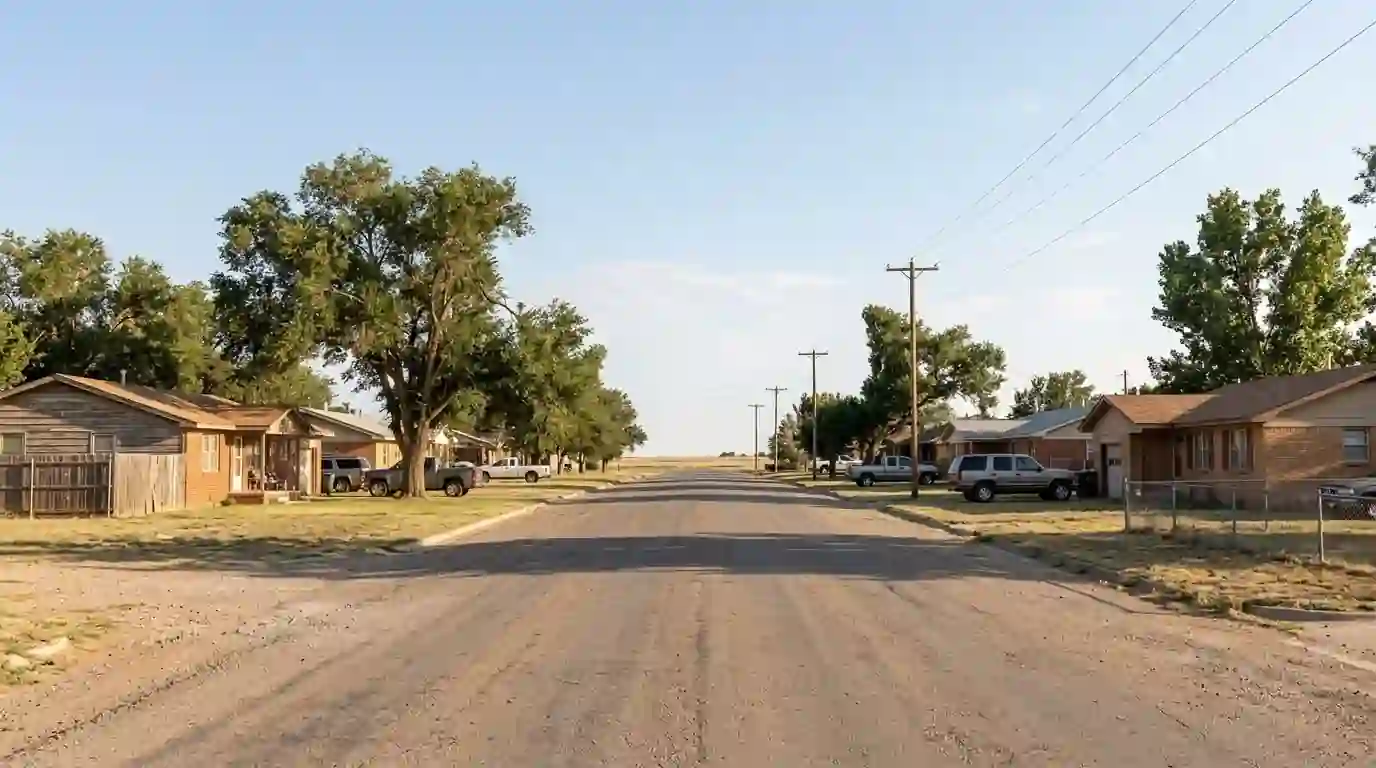 Residential street in Stinnett Texas with brick and frame homes